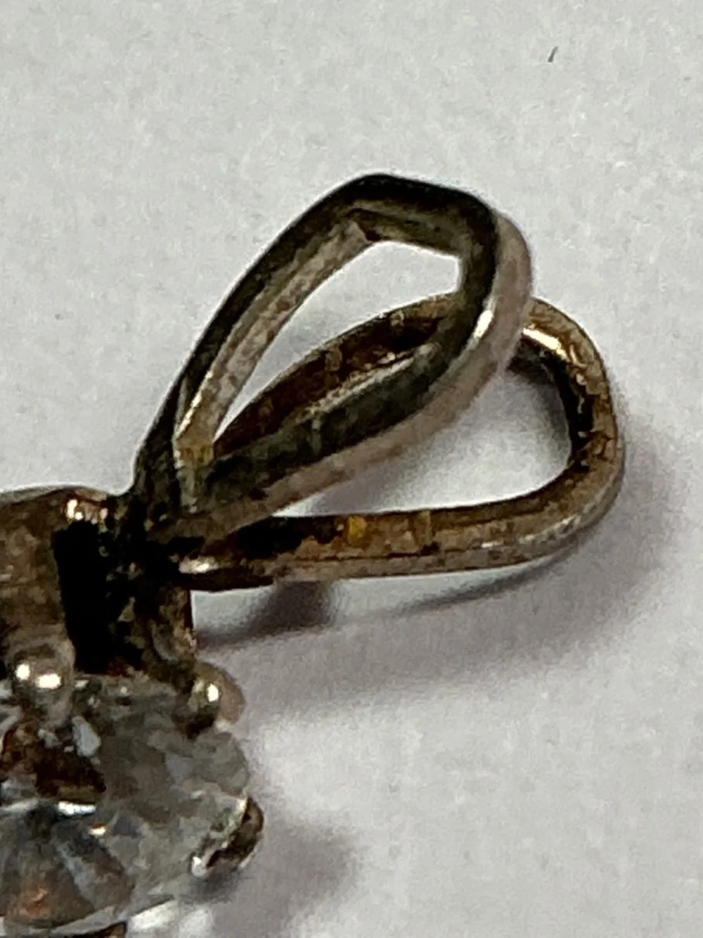 Sterling Silver Petite Pendant with a clear stone. 1/2 inches long
